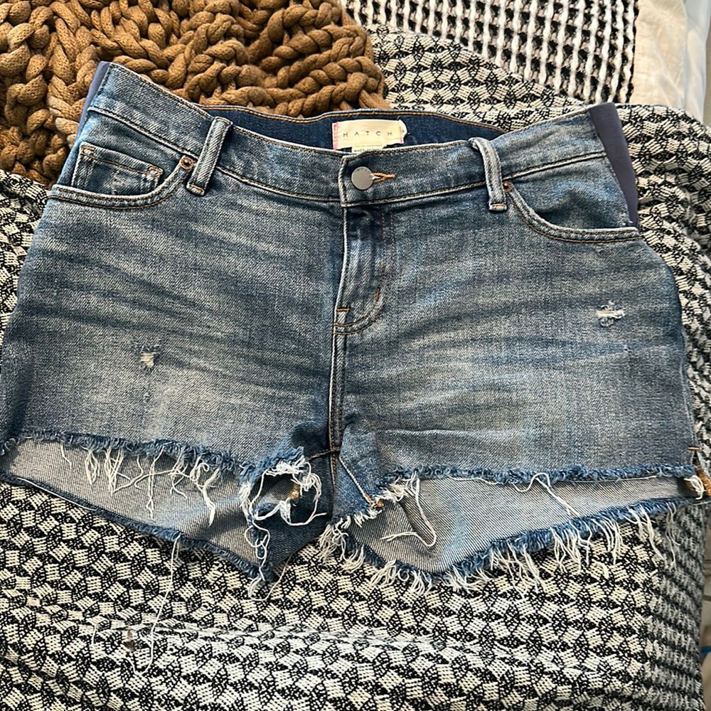 HATCH “LIKE A MAMA” CUT OFF DISTRESSED DENIM SHORTS